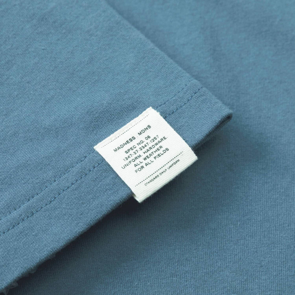 MADNESS BADGE (S) UNIFORM T-SHIRT-BLUE