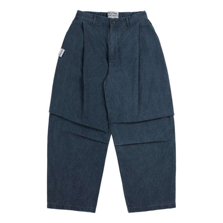 NEUTRAL SOCIETY PIGMENT DYE PARACHUTE PANTS-NAVY