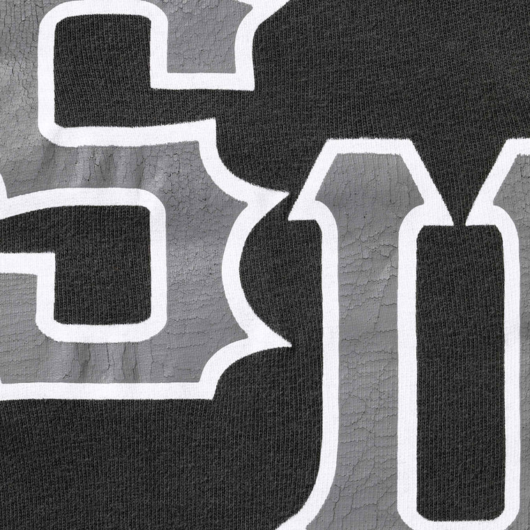 SUPREME CRACKED SPELLOUT S/S TOP-BLACK